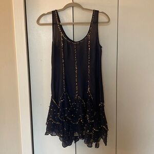 Navy blue flapper-style dress with gold sequins